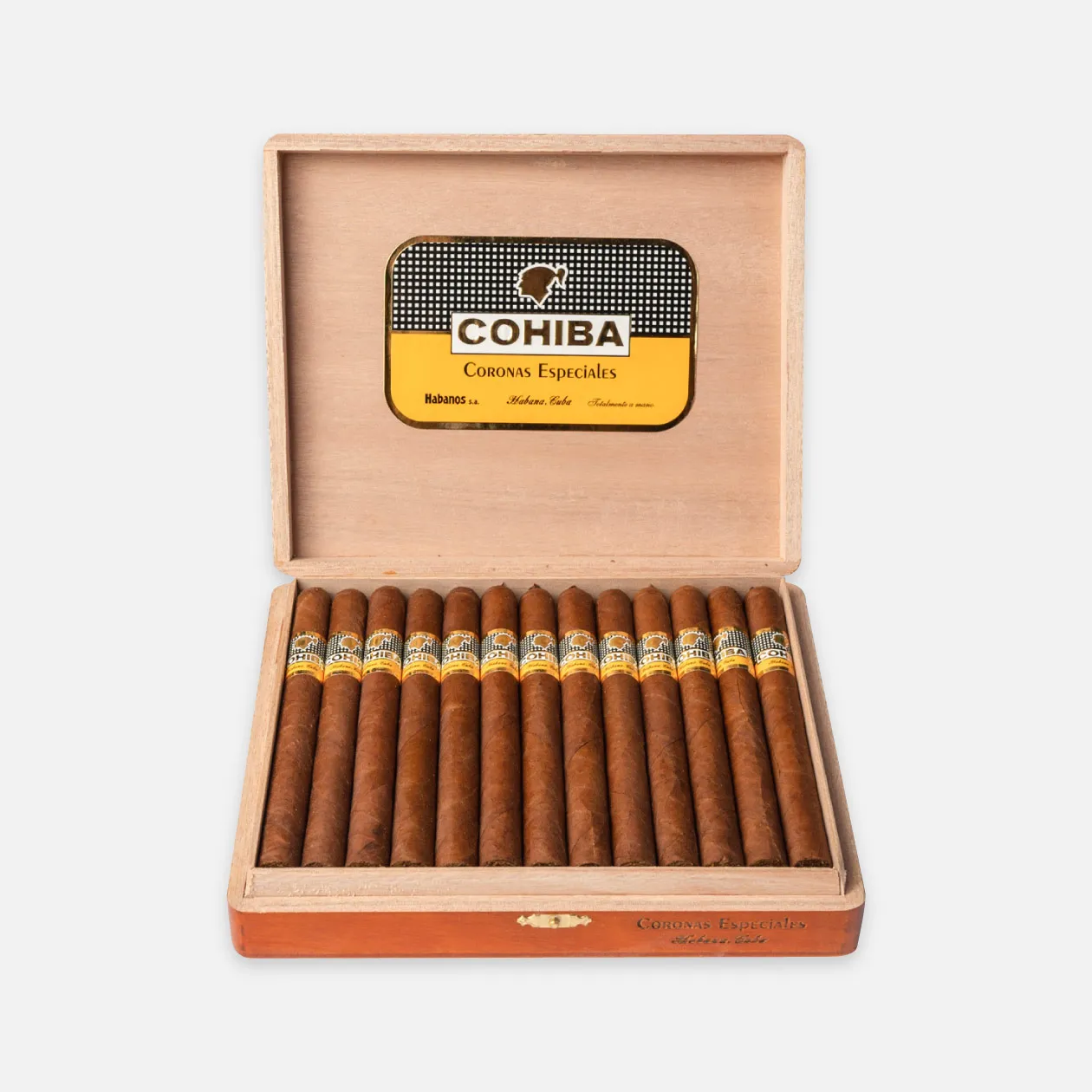 Cohiba Coronas Especiales cigars in elegant wooden box.