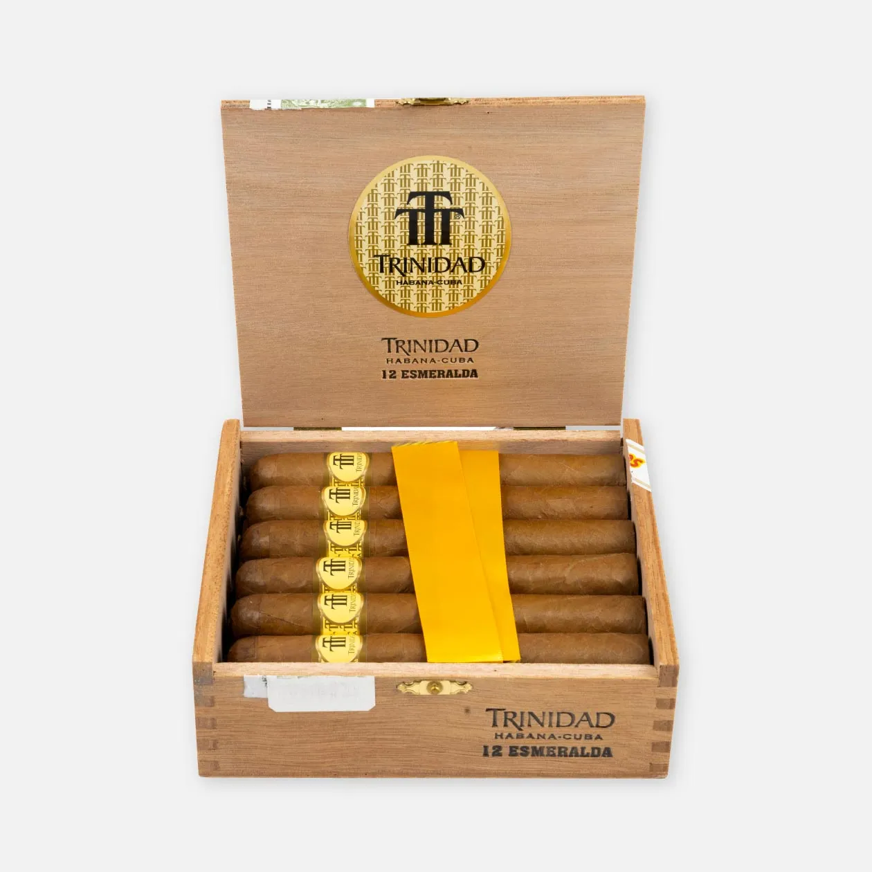 Trinidad Esmeralda cigars in an elegant wooden box with gold branding.