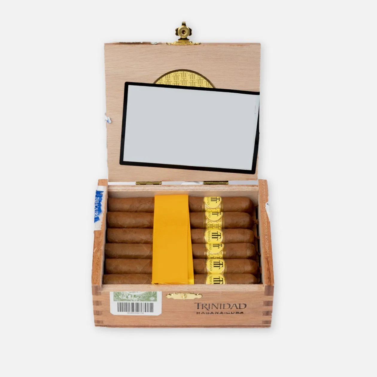 Trinidad cigars in an elegant open wooden box with golden bands.